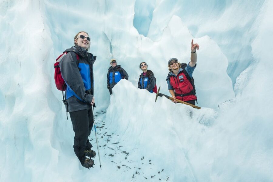 Fox Glacier: Up to 3 Hours Hike with Helicopter Transfer - Photo stops, short breaks, and how weather shapes your day