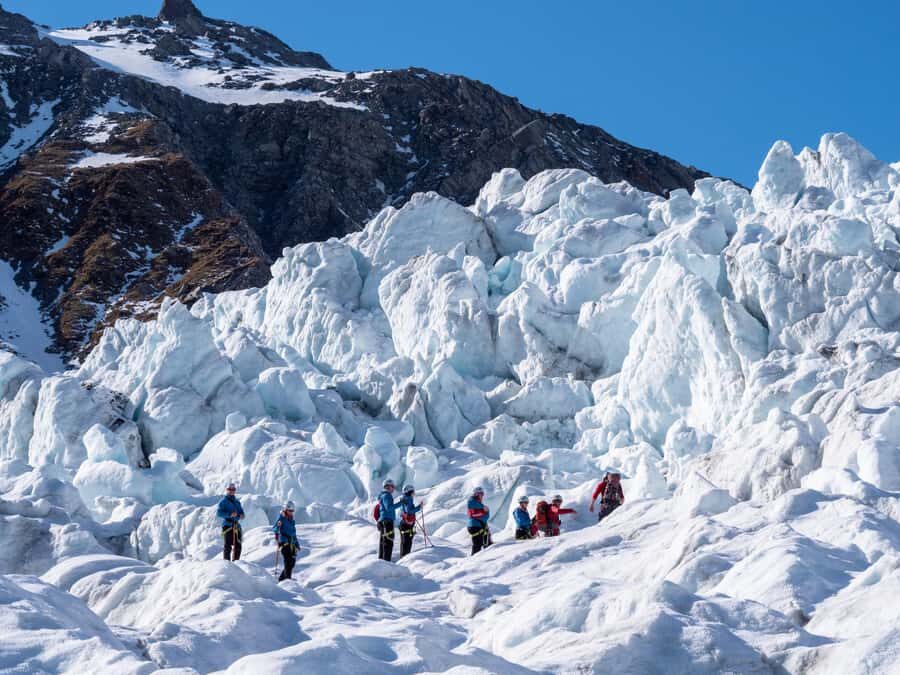 Franz Josef: 2.5 Hour Glacier Hike with Helicopter Transfer - Meeting point and start-of-day reality at Glacier Base Building