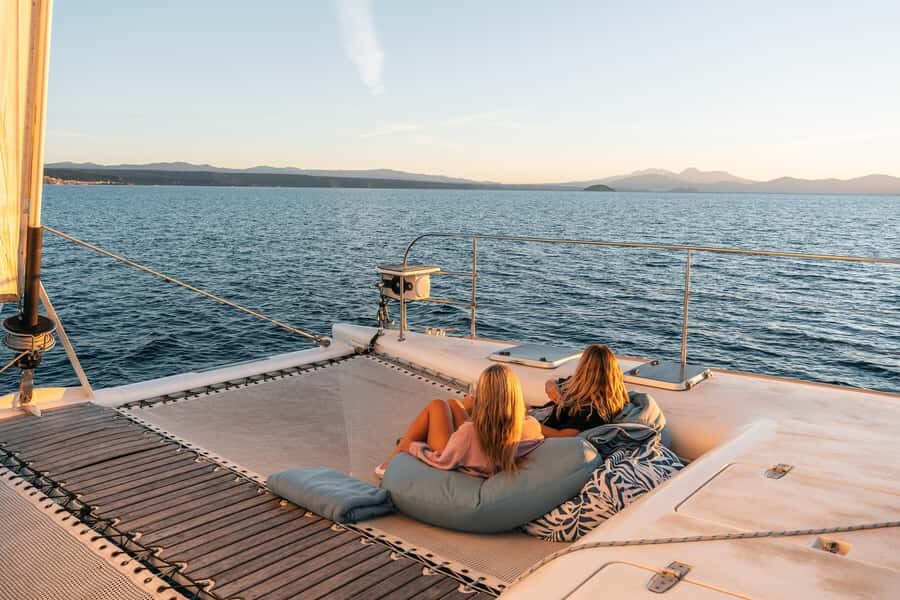 Lake Taupo: Luxury Sailing Catamaran to Māori Rock Carvings - The swim stop and the blanket return: the “extra” that changes everything